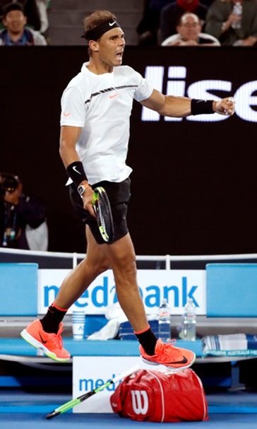 The Latest: Nadal beats Raonic, returns Grand Slam semis